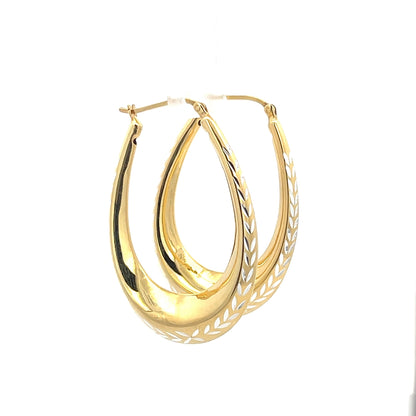 Creolen aus 925er Silber, 14 Karat gelbvergoldet, mit geschliffenen Details